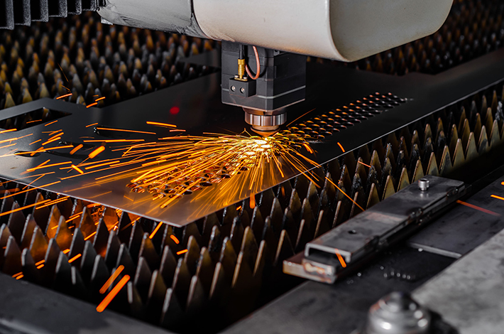 Fiber laser cutting machine in Pakistan processing metal sheet with precision.