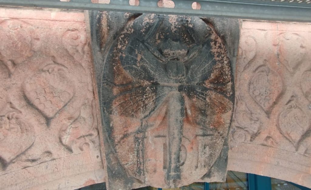 Oxidized stone carvings on stone buildings