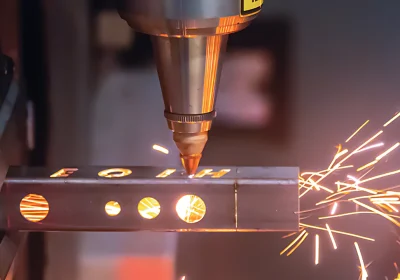 Close-up showing the kerf or cut width made by a laser tube cutter in metal